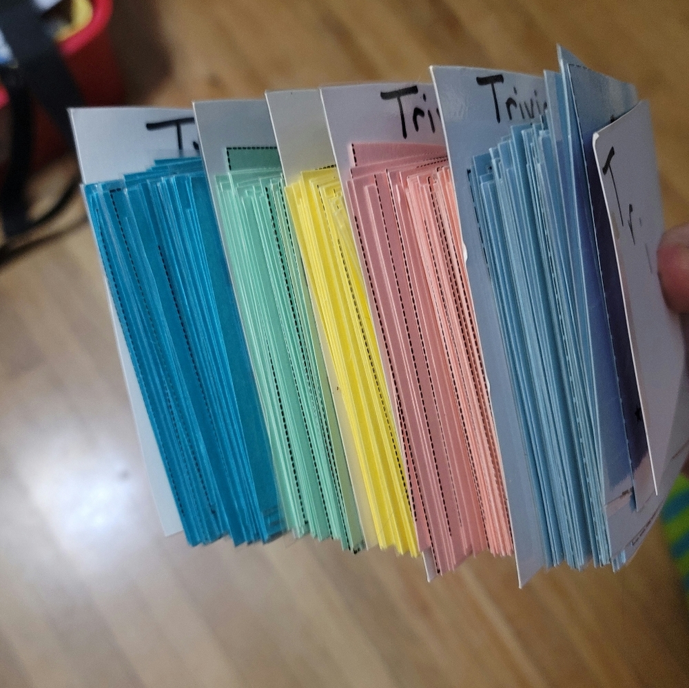 X-LG 5 1/2" STACK OF COLOR- CODED TRIVIA CARDS W/ ANSWERS